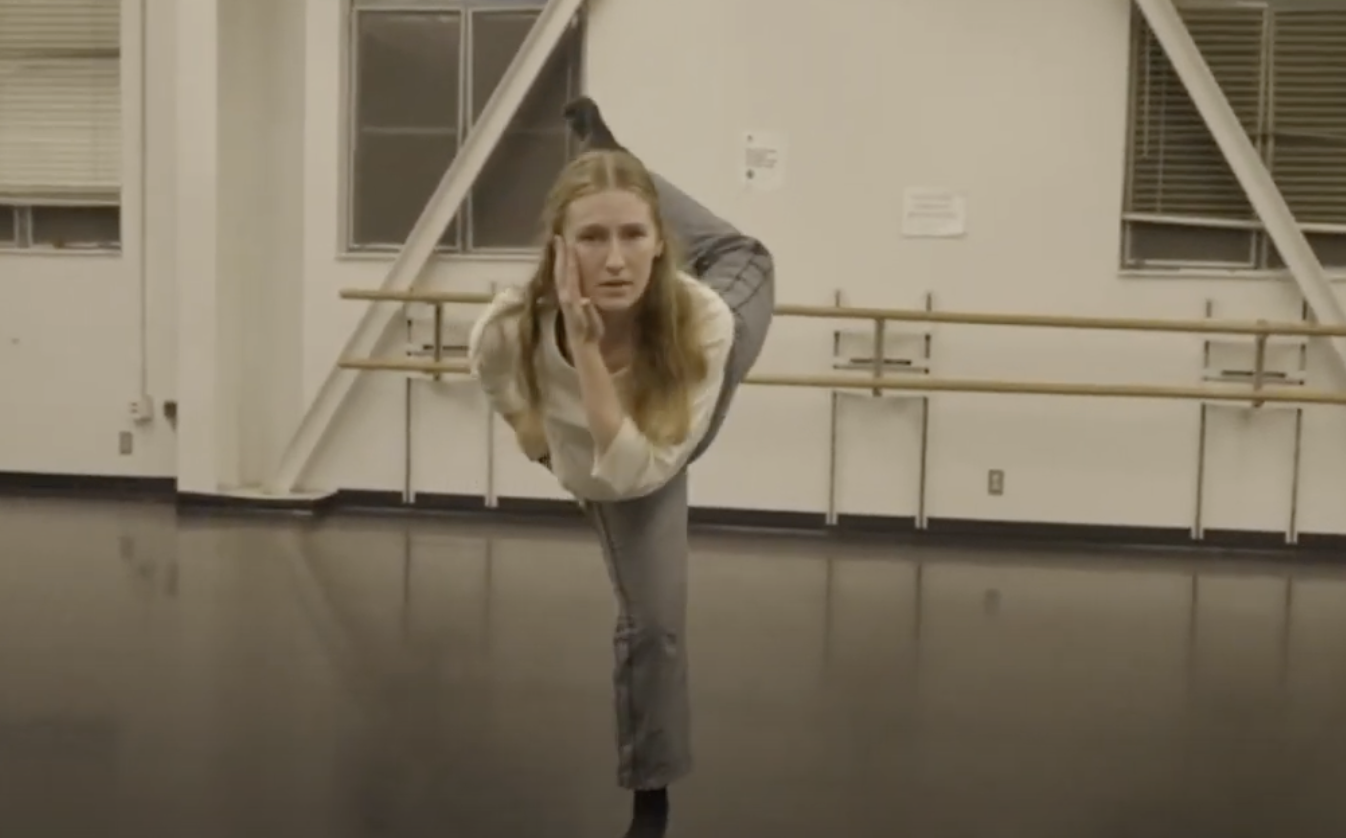 a dancer is mid dance routine.